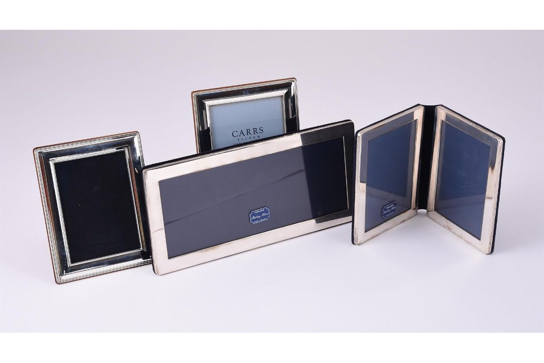 FOUR SILVER MOUNTED PHOTO FRAMES