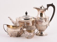 A MATCHED SILVER FOUR PIECE OVAL TEA SET