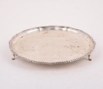 A SILVER SHAPED CIRCULAR SALVER