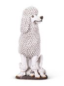 A WHIITE GAZED RED POTTERY POODLE ITALIAN