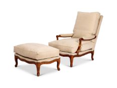 A MODERN ELM AND SUEDE UPHOLSTERED OVERSIZED ARMCHAIR WITH ACCOMPANYING STOOL BY SOANE