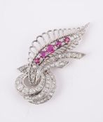 A FRENCH RUBY AND DIAMOND SCROLLING FOLIATE BROOCH MID 20TH CENTURY