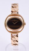 BAUME & MERCIER, REF. 38322 A LADY'S GOLD COLOURED BRACELET WATCH