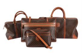 CELINE, A COATED CANVAS FOUR PIECE TRAVELLING LUGGAGE SET