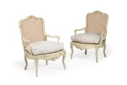 A PAIR OF WHITE PAINTED AND CANEWORK ARMCHAIRS, IN LOUIS XV STYLE