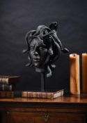 A BRONZED RESIN MODEL OF THE BUST OF A MALE GORGON OR 'MEDUSA'