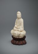 A Chinese Dehua miniature Guanyin