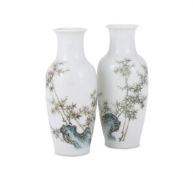 A pair of Chinese enamelled small vases
