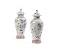 A pair of Chinese Famille Rose vases and covers