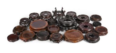 † A group of twenty-one Chinese circular hardwood stands
