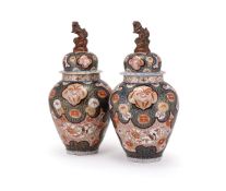 A large pair of Samson or Continental Imari vases and covers