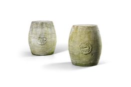 A large pair of stone barrel-shaped garden seats