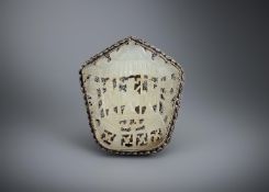 A Chinese reticulated white jade brooch