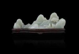 A Chinese celadon jade mountain-form brush rest
