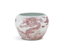 A large Chinese blue and white and underglaze red 'Dragon' jardinière