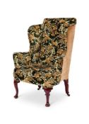 A WALNUT AND FLORAL TAPESTRY UPHOLSTERED WING ARMCHAIR OF GEORGE I STYLE