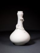 A CHINESE DEHUA 'DRAGON' BOTTLE VASE, QING DYNASTY