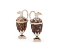 ‡ A PAIR OF WEDGWOOD WHITE TERRACOTTA AND FAUX-HARDSTONE EWERS, CIRCA 1770