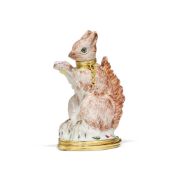 ‡ A GOLD-MOUNTED ‘GIRL IN THE SWING’ PORCELAIN SCENT-BOTTLE MODELLED AS A SQUIRREL, CIRCA 1755