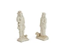 ‡ A PAIR OF STAFFORDSHIRE SALT-GLAZED STONEWARE FIGURES OF A SHEPHERD AND SHEPHERDESS, CIRCA 1750-55