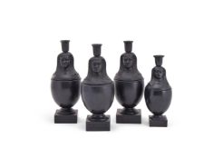 ‡ FOUR WEDGWOOD & BENTLEY BLACK BASALT CANOPIC JARS AND CANDLESTICK COVERS