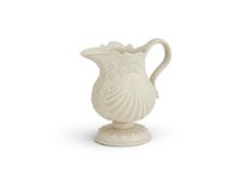 ‡ A STAFFORDSHIRE SALT-GLAZED STONEWARE PECTIN-SHELL CREAM-JUG, CIRCA 1750