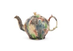 ‡ A STAFFORDSHIRE CREAMWARE 'LANDSKIP' TEAPOT AND COVER, CIRCA 1760-65