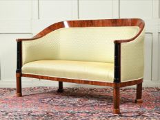 A WALNUT AND EBONISED SOFA IN BIEDERMEIER STYLE