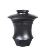 A BLACK PAINTED MODEL OF AN URN