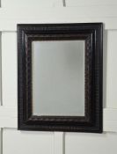 AN EBONISED AND SHIVER MOULDED FRAMED WALL MIRROR IN DUTCH 17TH CENTURY STYLE