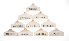 TEN VARIOUS ENGLISH POTTERY AND CREAMWARE WINE/BIN LABELS INCLUDING FIVE WEDGWOOD EXAMPLES