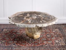 A PART POLISHED PETRIFIED WOOD CENTRE TABLE