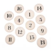 THIRTEEN GLAZED POTTERY NUMBERED WINE/BIN LABELS, MID 19TH CENTURY