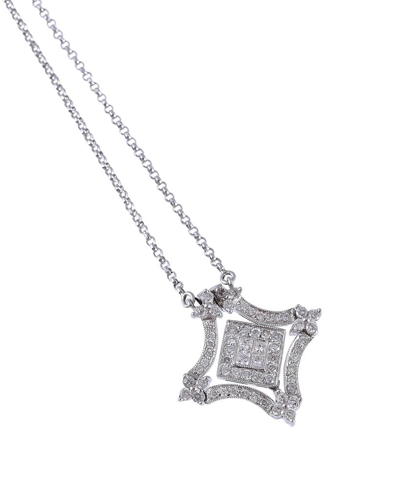 A DIAMOND METAMORPHIC PENDANT/NECKLACE