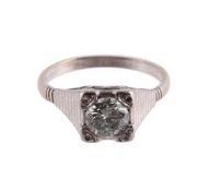 A SINGLE STONE DIAMOND RING, LONDON 1975