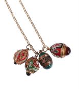 FOUR ENAMELLED EGG PENDANTS