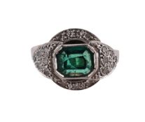 AN EMERALD AND DIAMOND DRESS RING