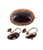 A LATE 19TH CENTURY GARNET BROOCH AND A PAIR OF SIMILAR EARRINGS