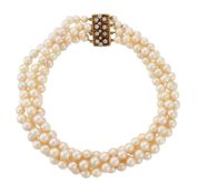 A FOUR ROW CULTURED PEARL NECKLACE TO A DIAMOND CLASP, LONDON 1981