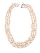 A THREE ROW CULTURED PEARL NECKLACE WITH DIAMOND CLASP