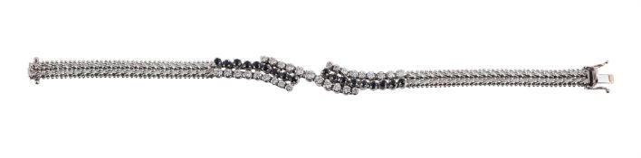 A SAPPHIRE AND DIAMOND CROSSOVER BRACELET