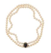 A TWO ROW CULTURED PEARL NECKLACE WITH GARNET 9CT GOLD CLASP, LONDON 1992