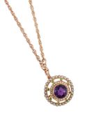 AN EARLY 20TH CENTURY AMETHYST, DEMANTOID GARNET AND SPLIT PEARL SUFFRAGETTE BROOCH/PENDANT