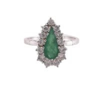 AN EMERALD AND DIAMOND CLUSTER RING