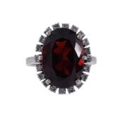 A GARNET AND DIAMOND CLUSTER RING
