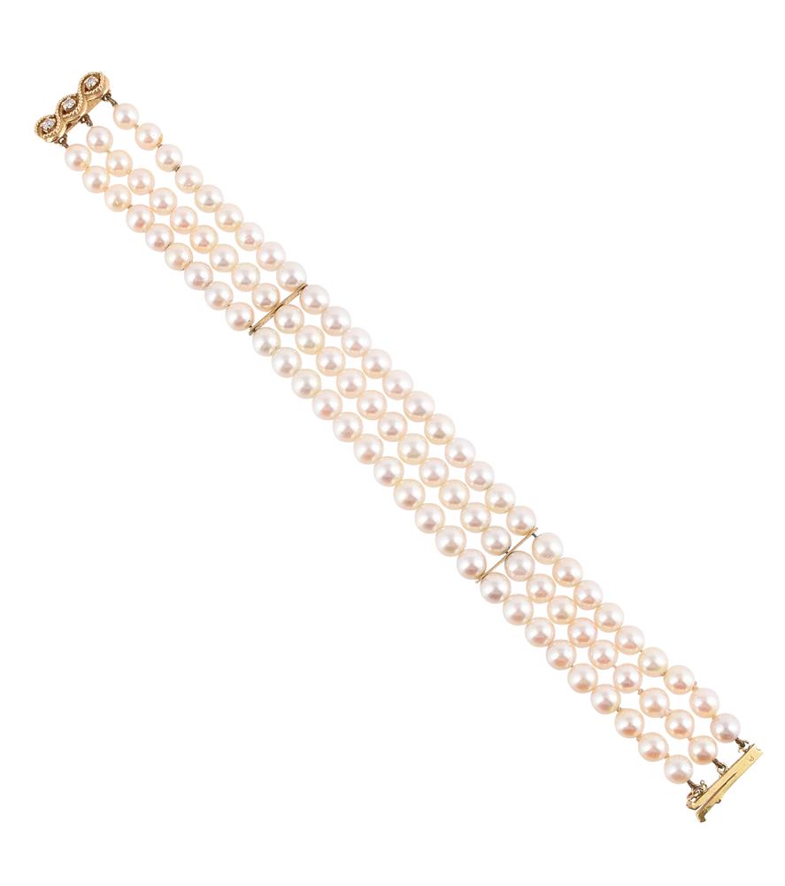 A FRENCH THREE STRAND CULTURED PEARL BRACELET WITH A DIAMOND CLASP