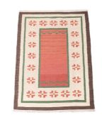 A KILIM CARPET WITH RED CENTRAL FIELD