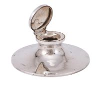 A SILVER CAPSTAN INKWELL