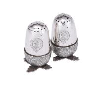 AN EDWARDIAN PAIR OF SILVER ACORN SALT AND PEPPER SHAKERS