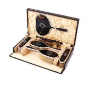 Y A CASED SILVER MOUNTED AND TORTOISESHELL DRESSING TABLE SET